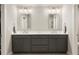 Elegant bathroom with dual sinks, vanity, mirrors, and modern lighting at 1603 Glen Ivy, Marietta, GA 30062