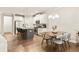 Open-concept kitchen with island seating and stainless steel appliances, next to dining area at 1603 Glen Ivy, Marietta, GA 30062