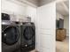 Functional laundry area with new front-load washer and dryer at 1603 Glen Ivy, Marietta, GA 30062