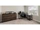 Dedicated home office space with dark wood dresser and an ergonomic desk setup at 1603 Glen Ivy, Marietta, GA 30062