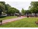 Serene park view with lush green grass, mature trees, a charming fountain, and inviting park benches at 1603 Glen Ivy, Marietta, GA 30062