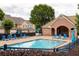 Relax by the community pool with ample seating, perfect for hot summer days and social gatherings at 1603 Glen Ivy, Marietta, GA 30062