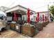 Outdoor seating area at a restaurant, complete with umbrellas and lush landscaping, inviting atmosphere at 1603 Glen Ivy, Marietta, GA 30062