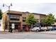 A bustling street showcases various restaurants with sidewalk seating and parked cars, creating a lively commercial scene at 1603 Glen Ivy, Marietta, GA 30062