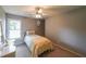 This bedroom features a ceiling fan with lighting, one bed, and a carpeted floor at 2970 Chardonnay Ln, Cumming, GA 30041