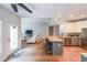 Open-concept living space featuring a modern kitchen, stainless steel appliances, and hardwood flooring at 2970 Chardonnay Ln, Cumming, GA 30041