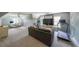 Spacious living room area with a ceiling fan, a sofa, and exercise equipment at 2970 Chardonnay Ln, Cumming, GA 30041