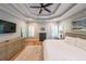 Comfortable main bedroom featuring a tray ceiling, hardwood floors, and ample natural light at 2970 Chardonnay Ln, Cumming, GA 30041