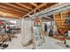 Unfinished basement with exposed wood framing, duct work, and storage shelving at 322 Emily Drive Sw, Lilburn, GA 30047