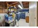 Unfinished basement featuring utility storage and open ceiling with exposed beams at 322 Emily Drive Sw, Lilburn, GA 30047