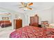 Cozy bedroom with ceiling fan, closet, and furnishings, providing a relaxing retreat at 322 Emily Drive Sw, Lilburn, GA 30047