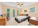 Bedroom with natural light, ceiling fan, carpet and furnishings, creating a peaceful ambiance at 322 Emily Drive Sw, Lilburn, GA 30047