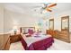 Comfortable bedroom with ample natural light and classic wooden furniture at 322 Emily Drive Sw, Lilburn, GA 30047
