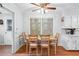 Cozy breakfast nook with a wooden table, four chairs, and natural light at 322 Emily Drive Sw, Lilburn, GA 30047