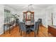 Elegant dining room with a large table, stylish chairs, and a classic china cabinet, perfect for formal dinners at 322 Emily Drive Sw, Lilburn, GA 30047