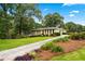 Beautiful single-story home with a sprawling lawn and mature trees, creating a serene and inviting landscape at 322 Emily Drive Sw, Lilburn, GA 30047