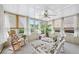 Relaxing sunroom with natural light, comfortable seating, and a serene view of the outdoors at 322 Emily Drive Sw, Lilburn, GA 30047