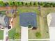 Aerial view of a home with a well-manicured lawn, backyard sheds, and ample parking space at 3631 Guinevere Trace Trce, Douglasville, GA 30135