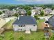Aerial view of a neighborhood showcasing well-maintained lawns and tree-lined streets at 3631 Guinevere Trace Trce, Douglasville, GA 30135