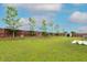 A large private backyard featuring a manicured lawn, a shed, and a fenced perimeter at 3631 Guinevere Trace Trce, Douglasville, GA 30135