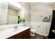 Well-lit bathroom features a large mirror, wood floors, and wainscoting at 3631 Guinevere Trace Trce, Douglasville, GA 30135