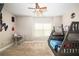 Comfortable bedroom featuring a bunk bed, ceiling fan, desk, and natural light from the large window at 3631 Guinevere Trace Trce, Douglasville, GA 30135