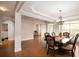 Formal dining room with hardwood floors, a decorative chandelier, and entry to another room at 3631 Guinevere Trace Trce, Douglasville, GA 30135