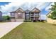 View of front yard and exterior of home with neutral siding, landscaping, and an attached two car garage at 3631 Guinevere Trace Trce, Douglasville, GA 30135