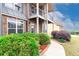 Beautifully landscaped home exterior featuring manicured bushes and a well-maintained sidewalk at 3631 Guinevere Trace Trce, Douglasville, GA 30135