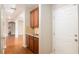Inviting hallway features wood floors, a convenient granite-topped counter, and seamless flow into the living spaces at 3631 Guinevere Trace Trce, Douglasville, GA 30135