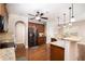 Kitchen features granite countertops, a stainless steel refrigerator and gas range, and pendant lighting at 3631 Guinevere Trace Trce, Douglasville, GA 30135