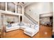 Spacious living room with lots of natural light, hardwood flooring, and access to dining room at 3631 Guinevere Trace Trce, Douglasville, GA 30135