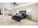 Spacious main bedroom with a sitting area, tray ceiling, neutral carpet, and ample natural light at 3631 Guinevere Trace Trce, Douglasville, GA 30135