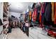 Spacious walk-in closet with custom shelving, storage, and organized racks for clothes and shoes at 3631 Guinevere Trace Trce, Douglasville, GA 30135