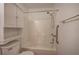 Bathroom featuring a tub with shower and accessibility bars at 668 Spring Place Ne Rd, White, GA 30184
