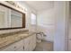 Bathroom vanity with granite countertop, modern fixtures, and a tile floor at 668 Spring Place Ne Rd, White, GA 30184