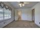 Bedroom with carpet, a ceiling fan, and doorways to other rooms, providing ample space at 668 Spring Place Ne Rd, White, GA 30184