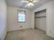 Neutral bedroom features a window and closet at 668 Spring Place Ne Rd, White, GA 30184