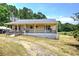 Lovely home featuring a quaint covered front porch and beautiful curb appeal at 668 Spring Place Ne Rd, White, GA 30184