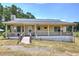 Charming single-story home featuring a cozy front porch and well-maintained landscaping at 668 Spring Place Ne Rd, White, GA 30184