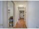 Hallway with hardwood flooring and access to closets at 668 Spring Place Ne Rd, White, GA 30184