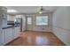 Spacious kitchen with hardwood floors, stainless steel appliances, and an eat-in area at 668 Spring Place Ne Rd, White, GA 30184
