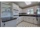 Well-equipped kitchen with white cabinets, modern appliances, and ample counter space at 668 Spring Place Ne Rd, White, GA 30184