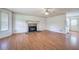 Living room featuring hardwood floors and decorative fireplace at 668 Spring Place Ne Rd, White, GA 30184
