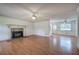 Spacious living room with hardwood floors and stone fireplace at 668 Spring Place Ne Rd, White, GA 30184
