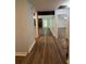 Inviting hallway with pristine blue walls transitioning to a living space with a stone fireplace at 8249 Creekline Ct, Riverdale, GA 30274