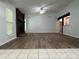 Bright living room with a stone fireplace and views of the kitchen and dining area at 8249 Creekline Ct, Riverdale, GA 30274