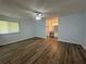 Generously sized primary bedroom offering abundant natural light, a ceiling fan, and wood-look floors at 8249 Creekline Ct, Riverdale, GA 30274