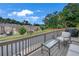 Relaxing outdoor deck area with seating and a view of the neighborhood at 2530 Clairebrooke Bend, Atlanta, GA 30341