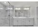 Bright bathroom featuring a walk-in shower with marble tiling and double vanity at 2530 Clairebrooke Bend, Atlanta, GA 30341